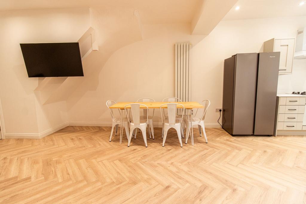 Bright and modern living area featuring a large...