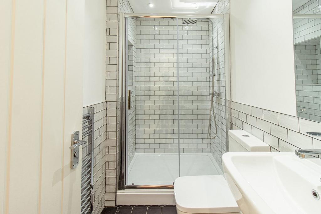 Modern bathroom with a spacious shower enclosur...