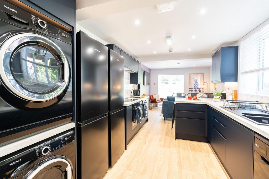 Modern and stylish kitchen featuring sleek navy...