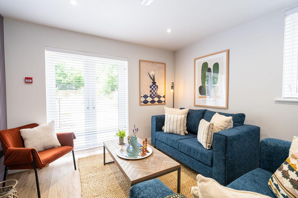 Bright and stylish living room with large windo...