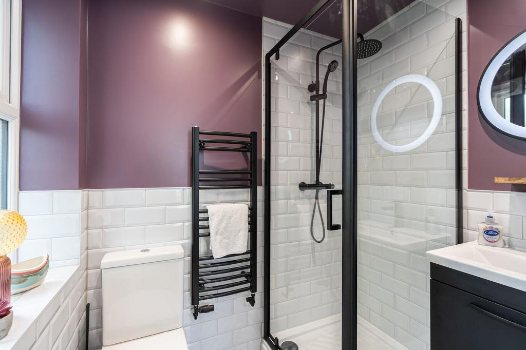 Modern bathroom featuring a sleek walk-in showe...