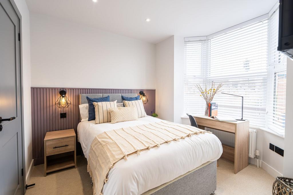 A beautifully decorated spacious master bedroom...