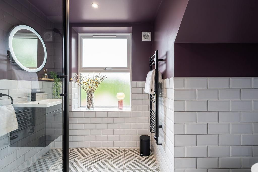 Bright, modern bathroom featuring a large frost...