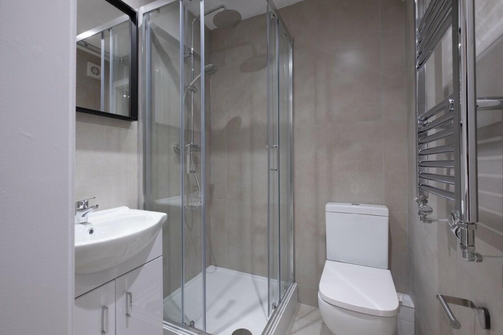 Modern and well-maintained bathroom featuring a...