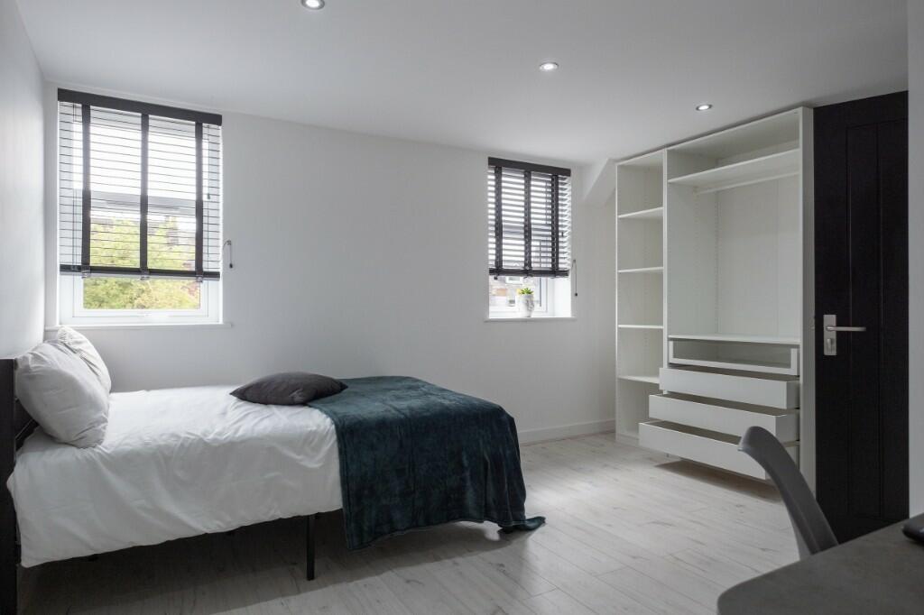 Bright and modern single bedroom featuring two ...