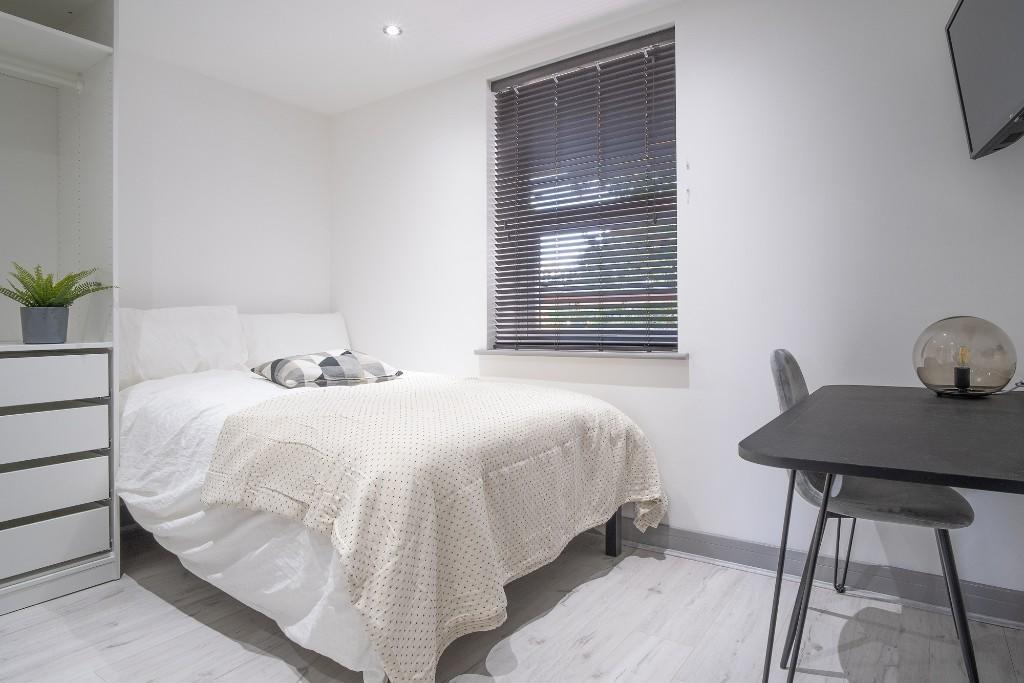 Bright and inviting double bedroom featuring a ...
