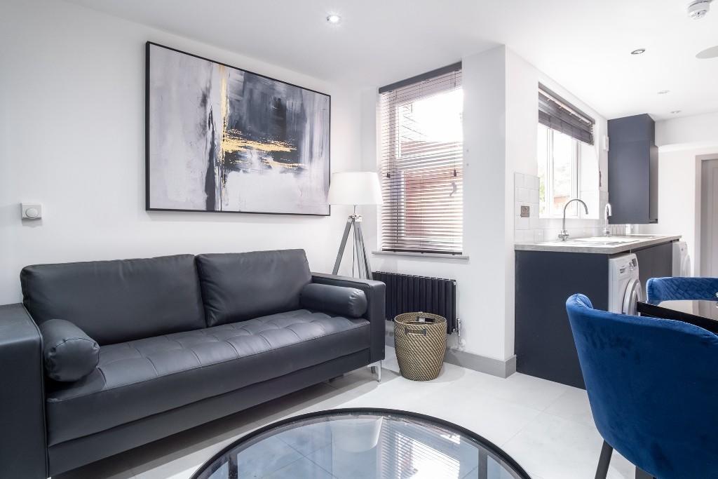 A stylish and well-lit contemporary living room...