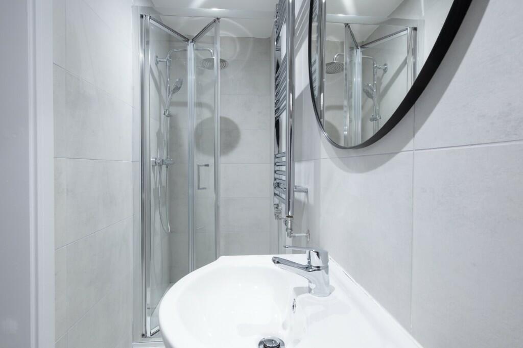 A modern, well-maintained bathroom with a spaci...