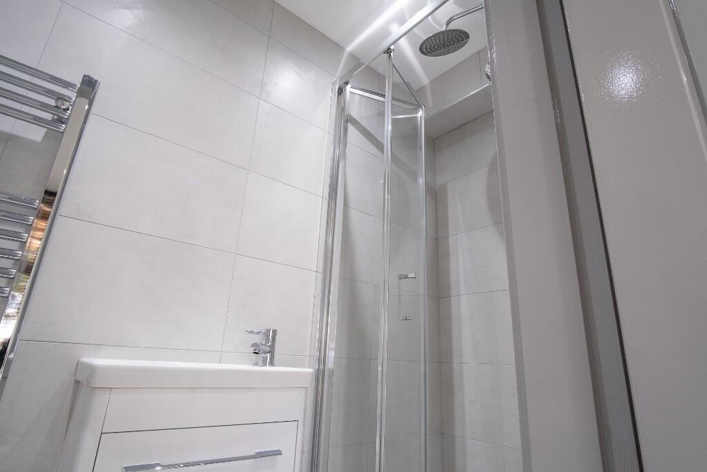 A modern, well-maintained bathroom featuring a ...