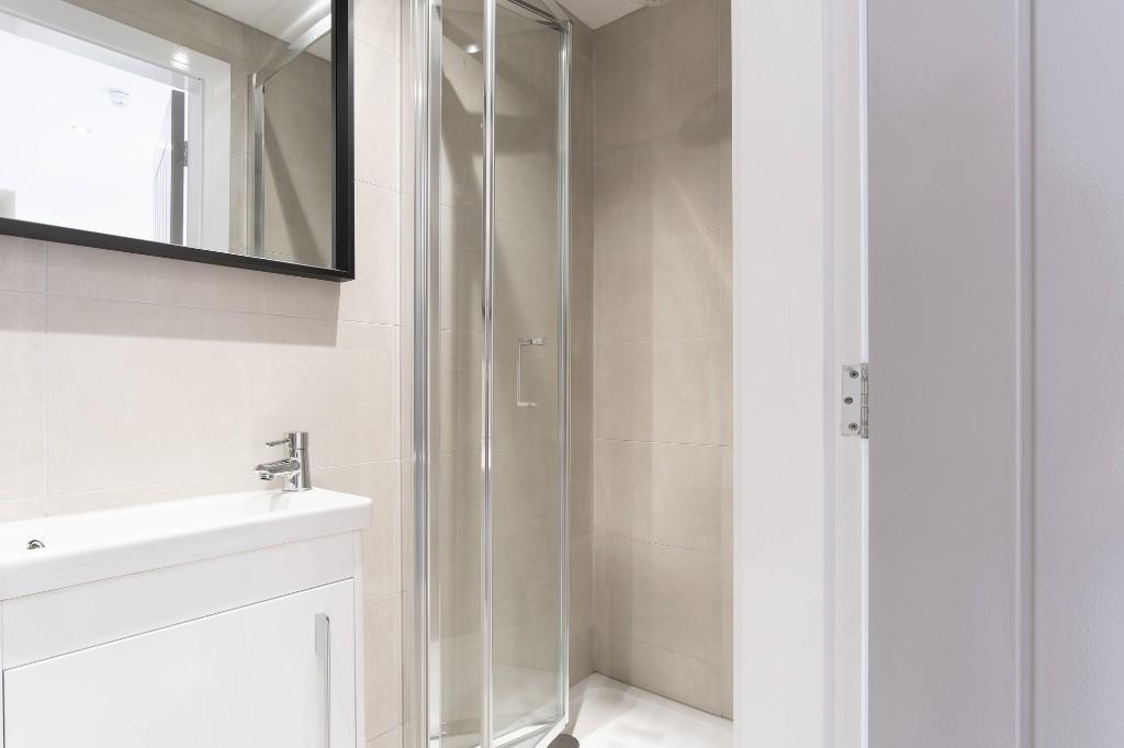 A clean, well-maintained bathroom featuring a s...