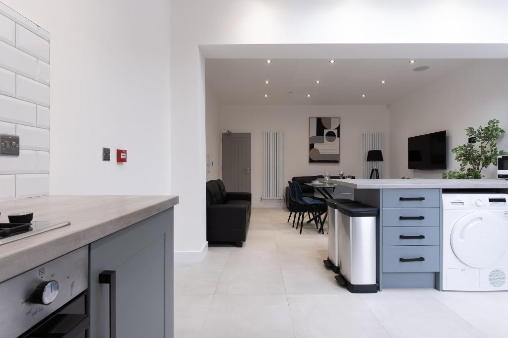 A bright and spacious modern living area with a...