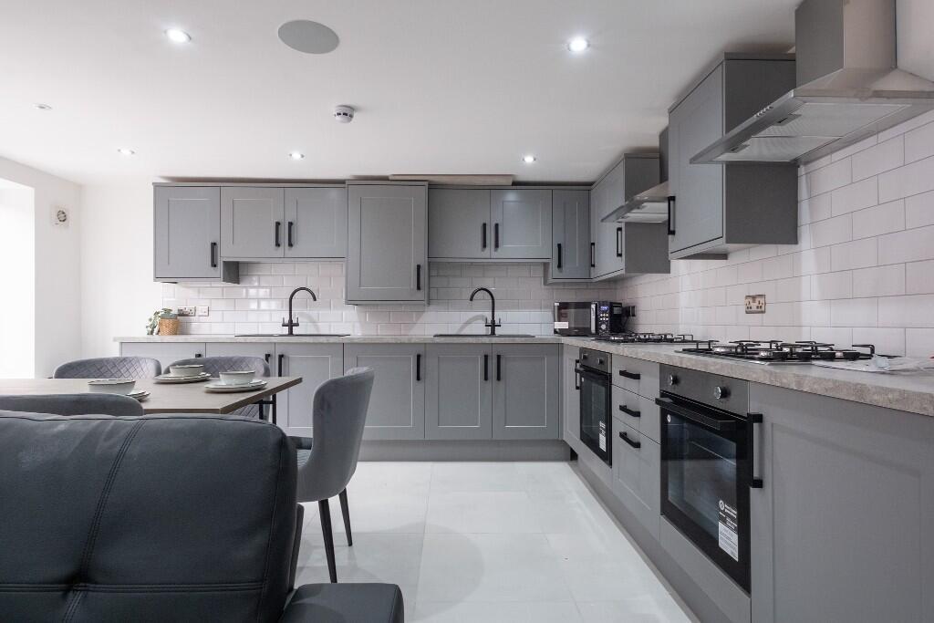 Modern and well-maintained kitchen area featuri...
