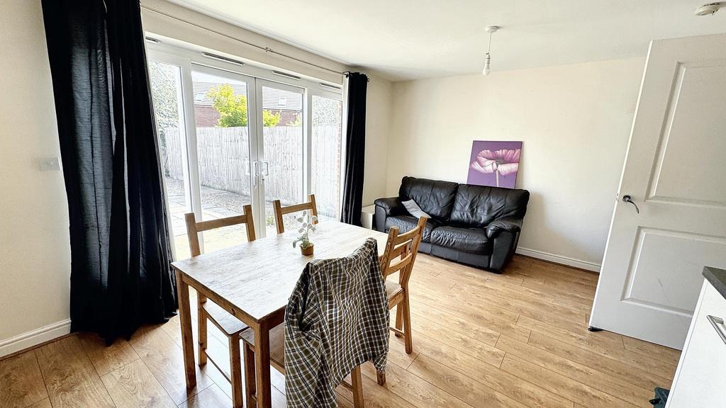 Bright and welcoming living room with ample nat...