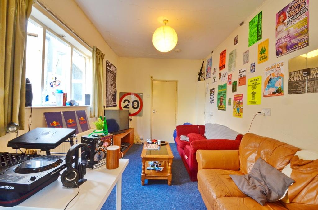 A bright and welcoming living room featuring co...