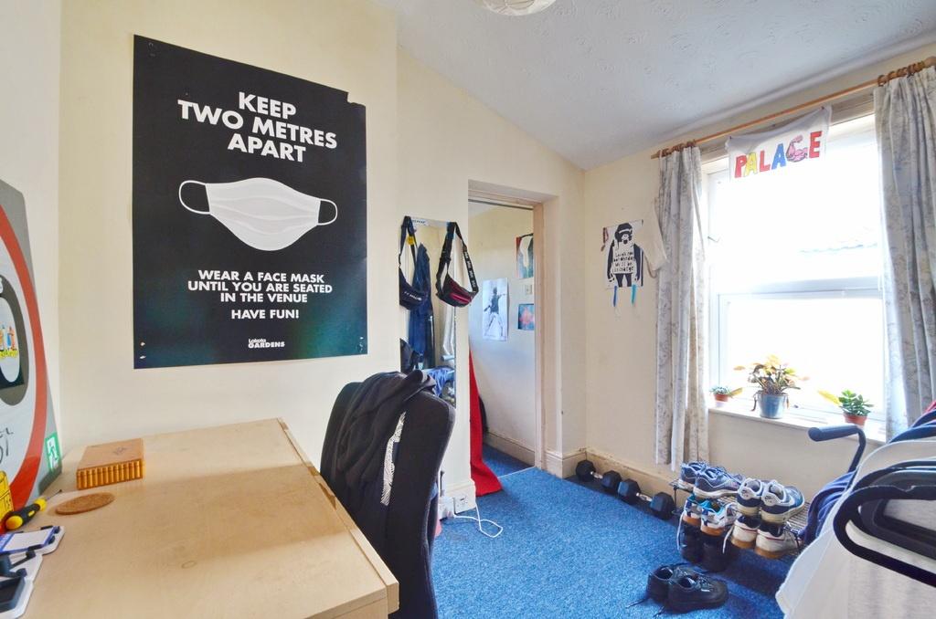 A bright and inviting bedroom with large window...