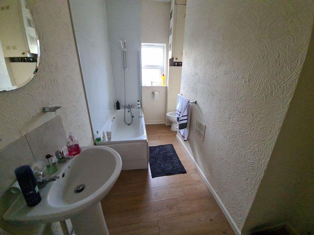 A clean, well-maintained bathroom featuring a b...