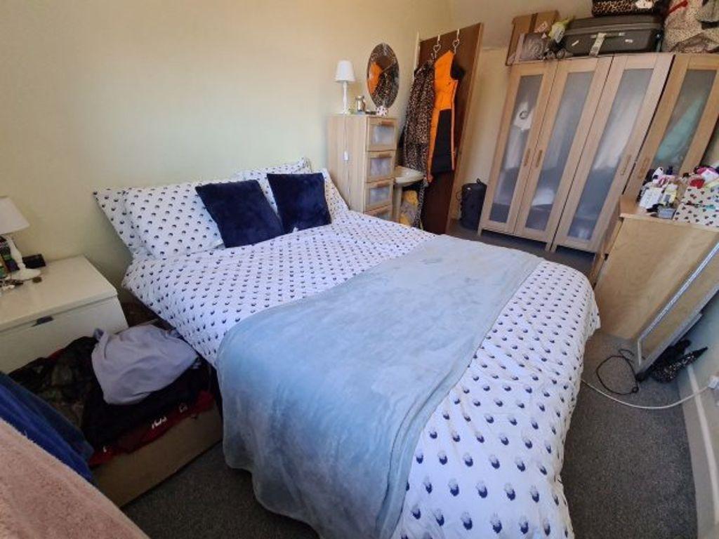 A spacious and well-maintained master bedroom f...