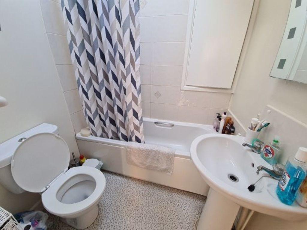 A large, well-maintained bathroom featuring a s...