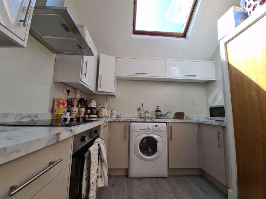 A modern, well-organized kitchen with ample cou...