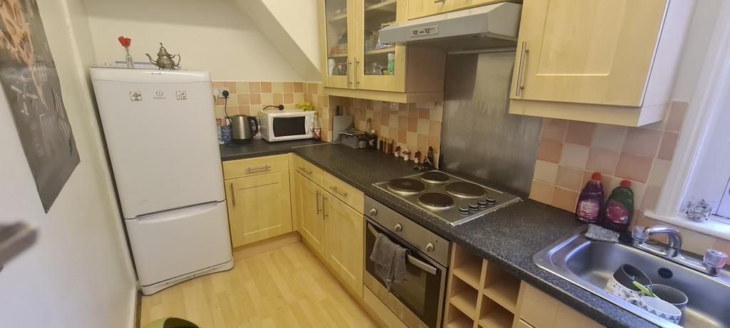 Bright and well-organized kitchen with ample co...