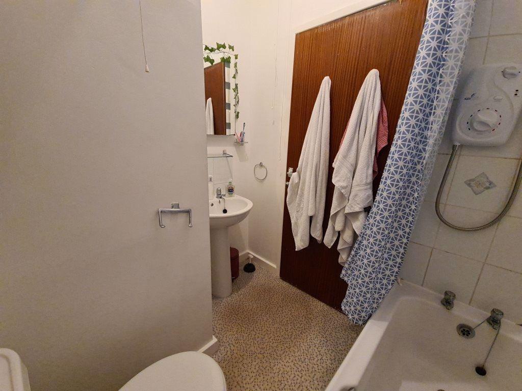 A clean and functional bathroom with essential ...