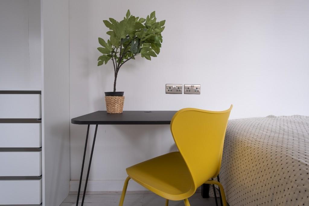 A clean, modern single toilet area featuring a ...