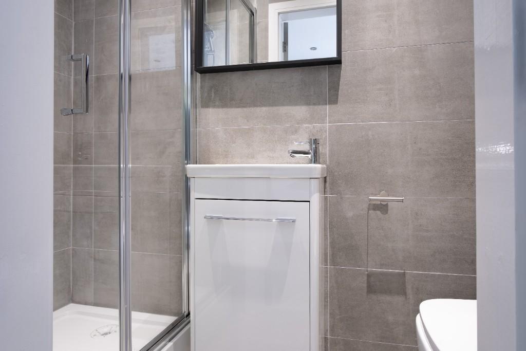 A modern, well-maintained bathroom suite featur...