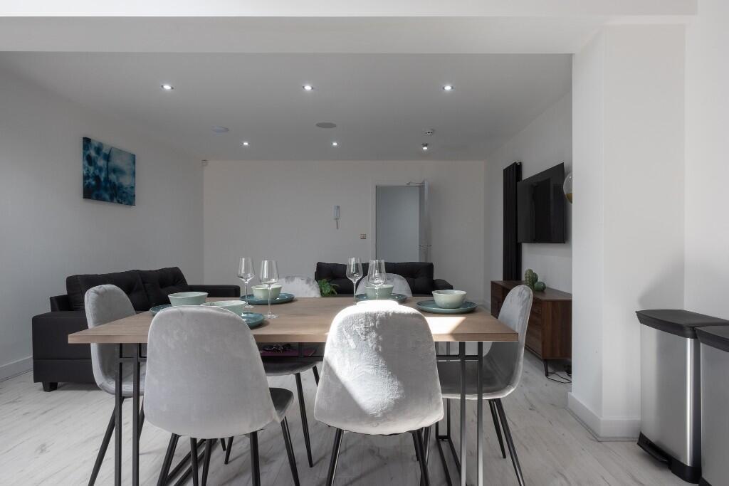 A modern, well-maintained living room featuring...