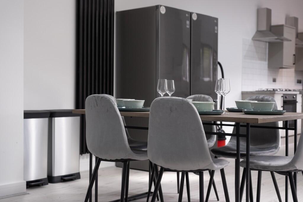 A modern and stylish living room area featuring...