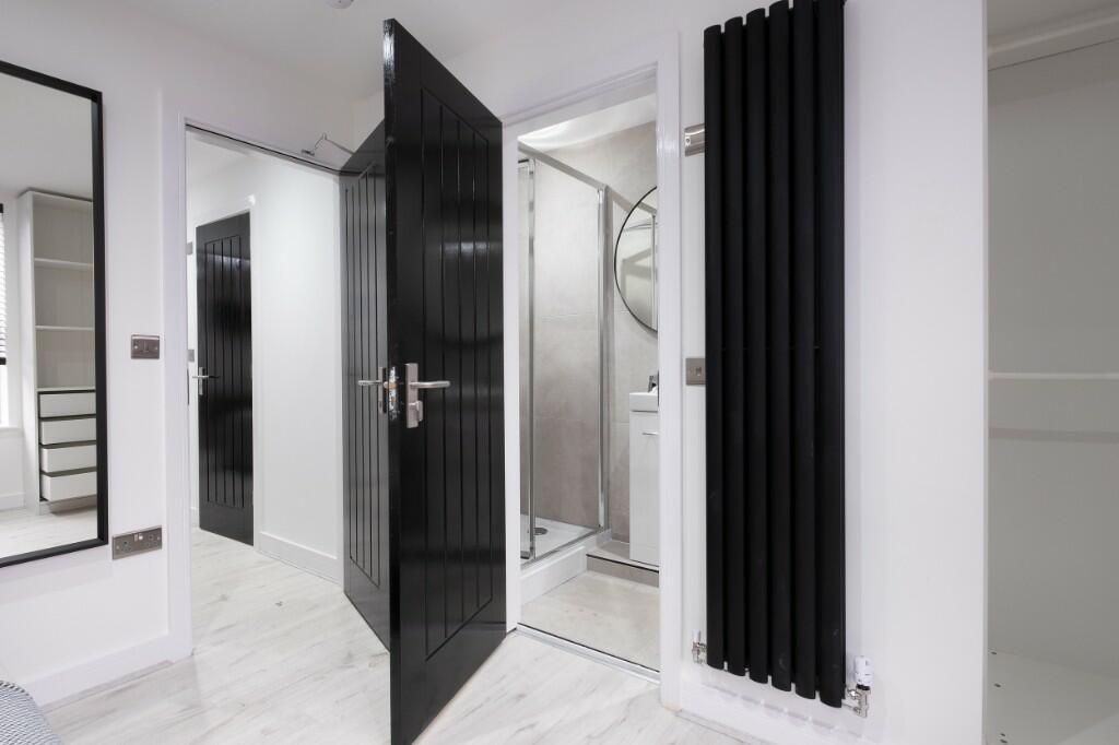 A modern, clean bathroom featuring a spacious s...