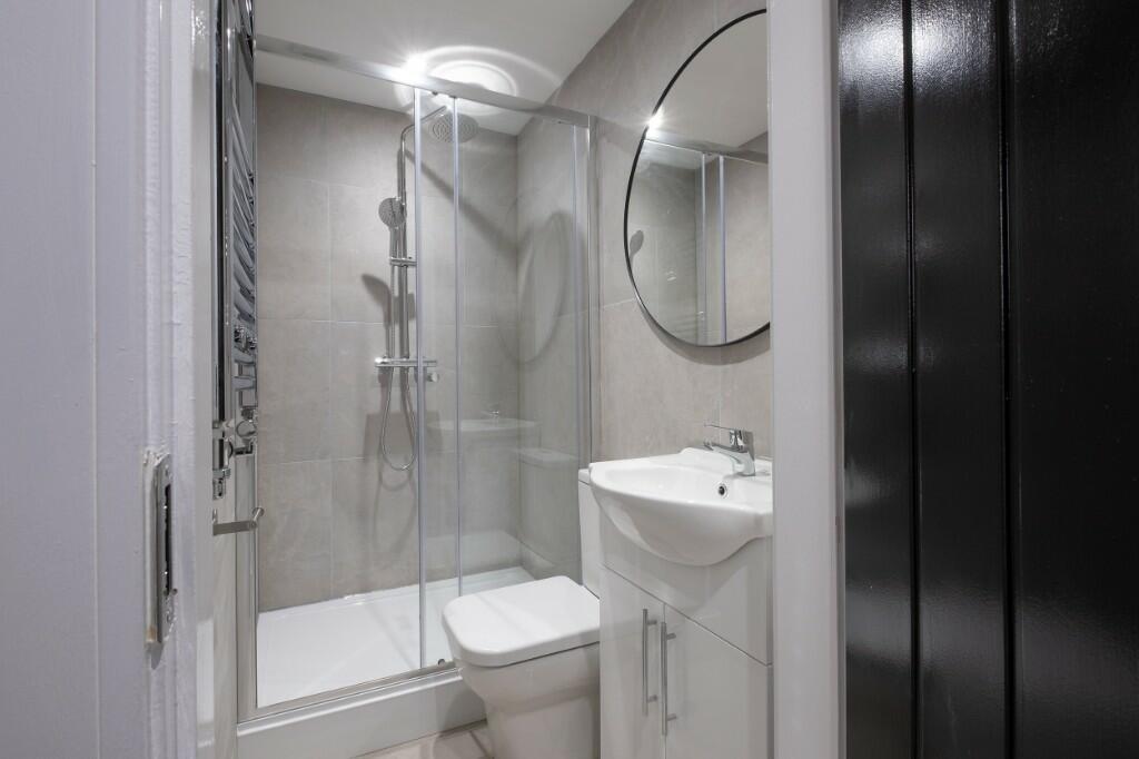 A modern, well-maintained bathroom featuring a ...