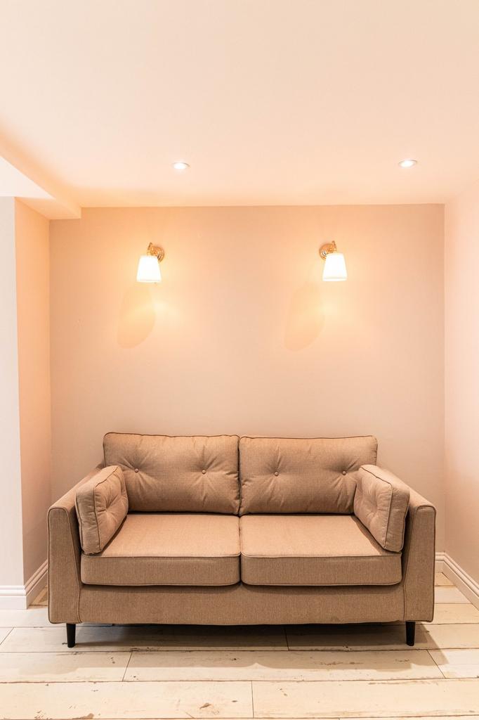 A cozy and well-maintained living room featurin...