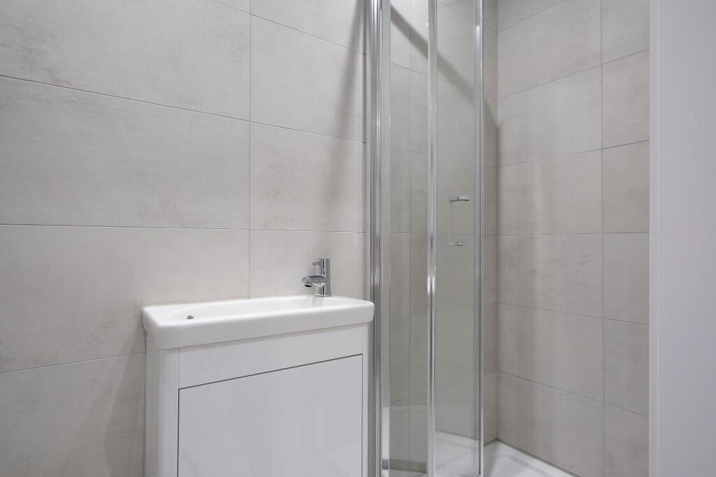 A modern, well-maintained bathroom featuring a ...