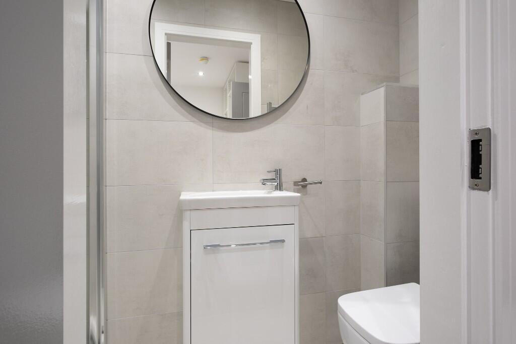 A modern, well-maintained bathroom featuring a ...