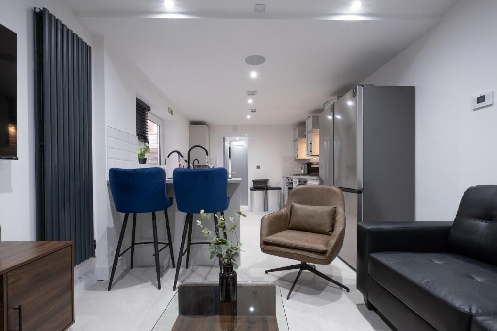 Modern and inviting living room featuring conte...