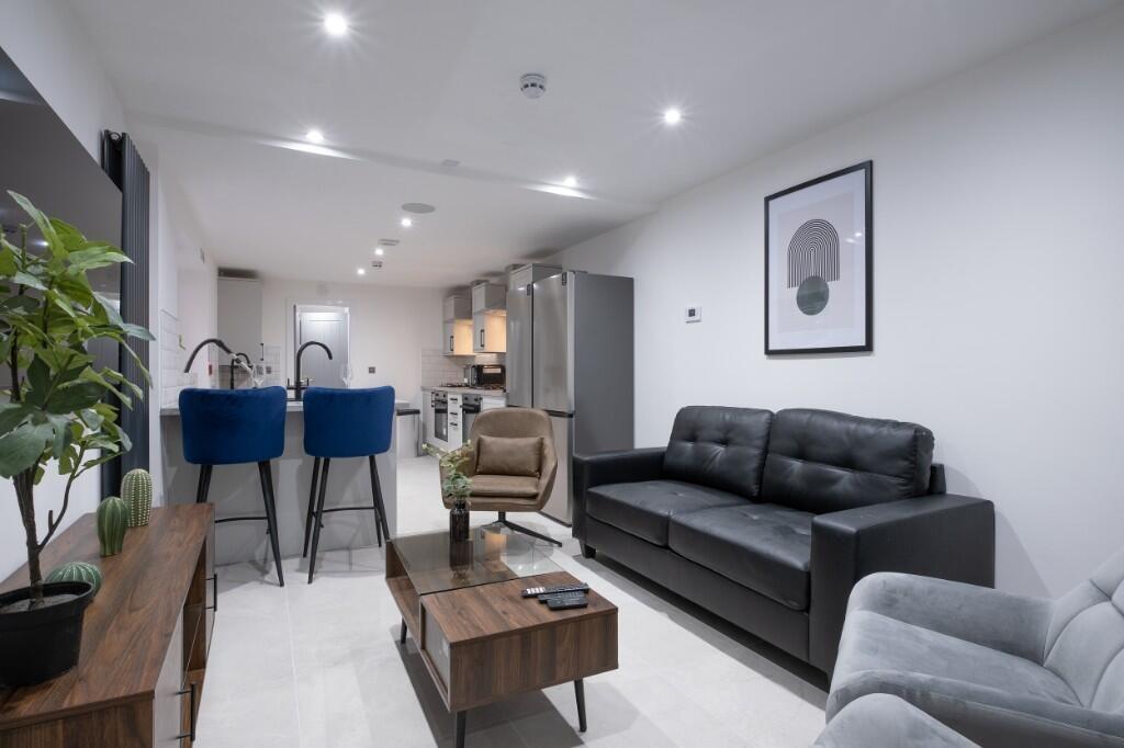 Modern and inviting living room featuring a lar...