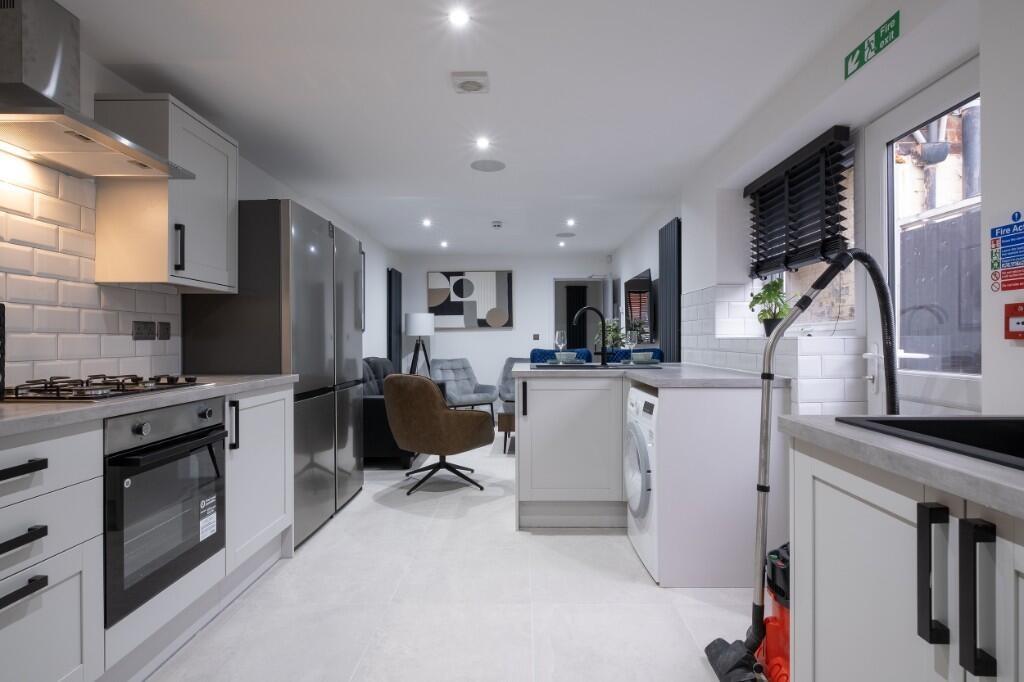 Bright and modern living area featuring ample n...