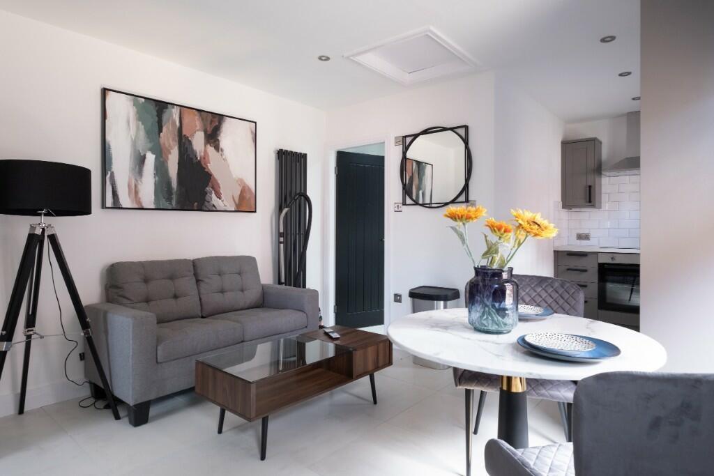 A modern and bright living room with a comforta...