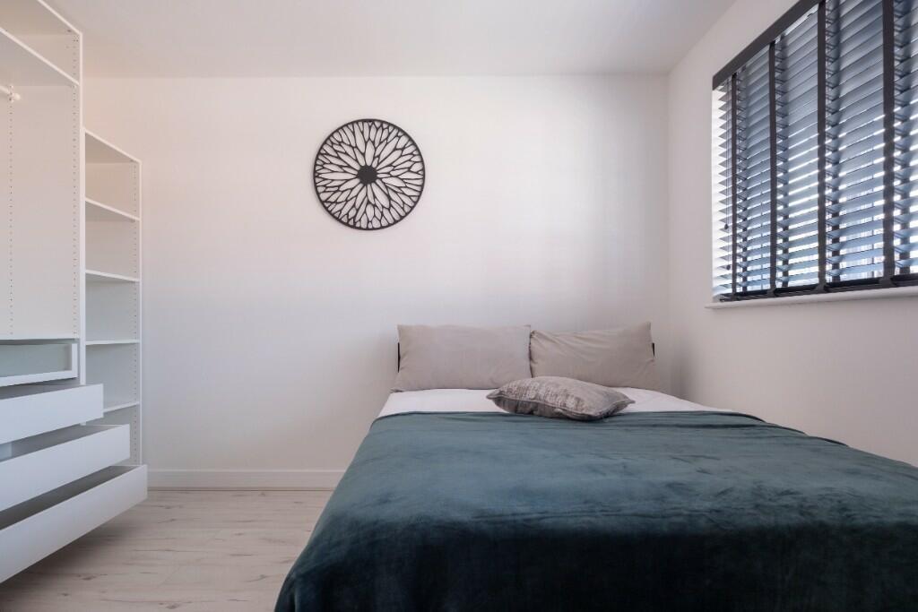A spacious and neatly maintained master bedroom...