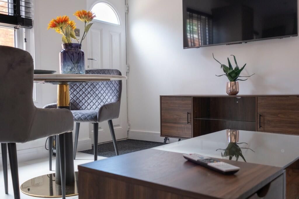 A modern and well-maintained living room with c...