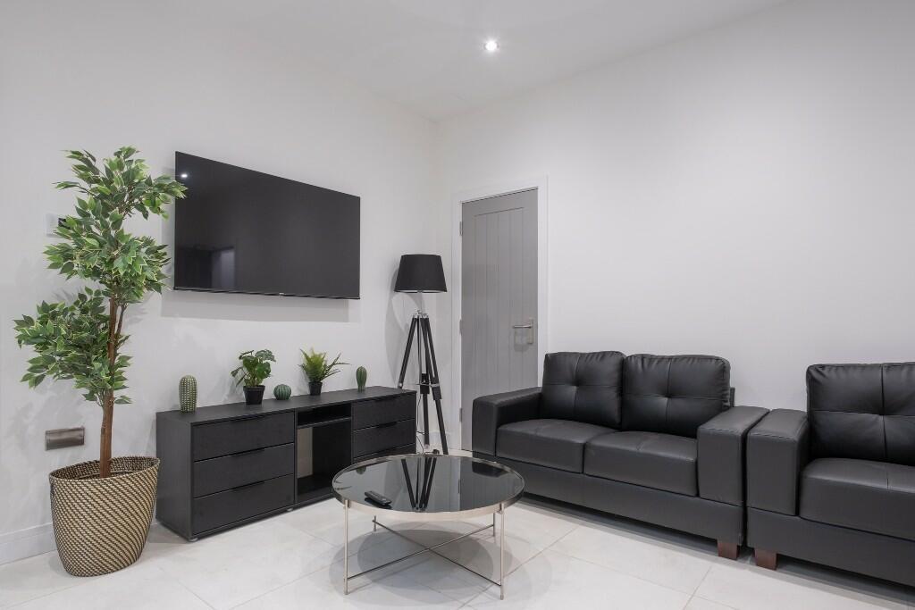 A contemporary and well-maintained living room ...
