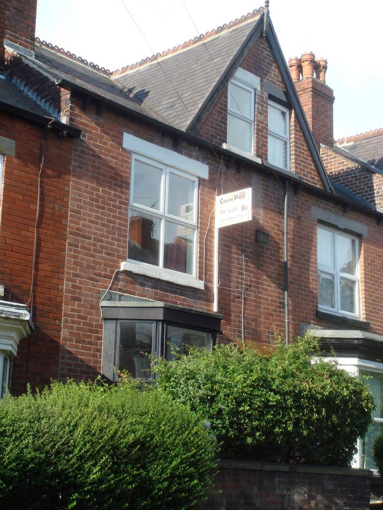 Exterior view of a traditional brick house with...