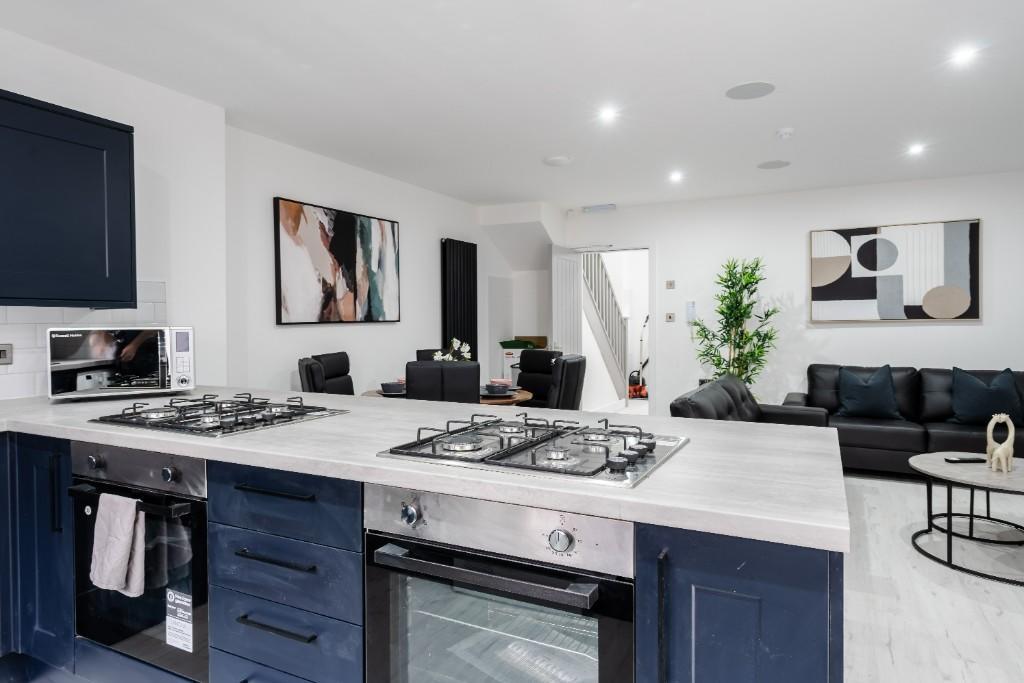 A modern, spacious living room featuring contem...