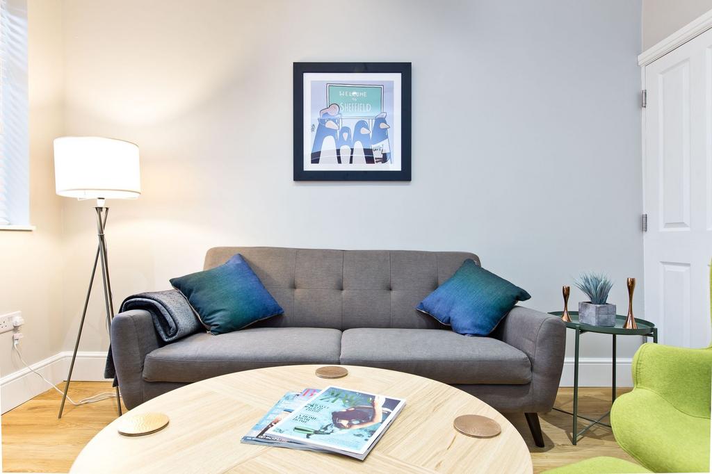 Bright, contemporary living area with a grey tw...