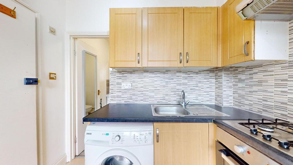 Bright and functional kitchen with wooden cabin...