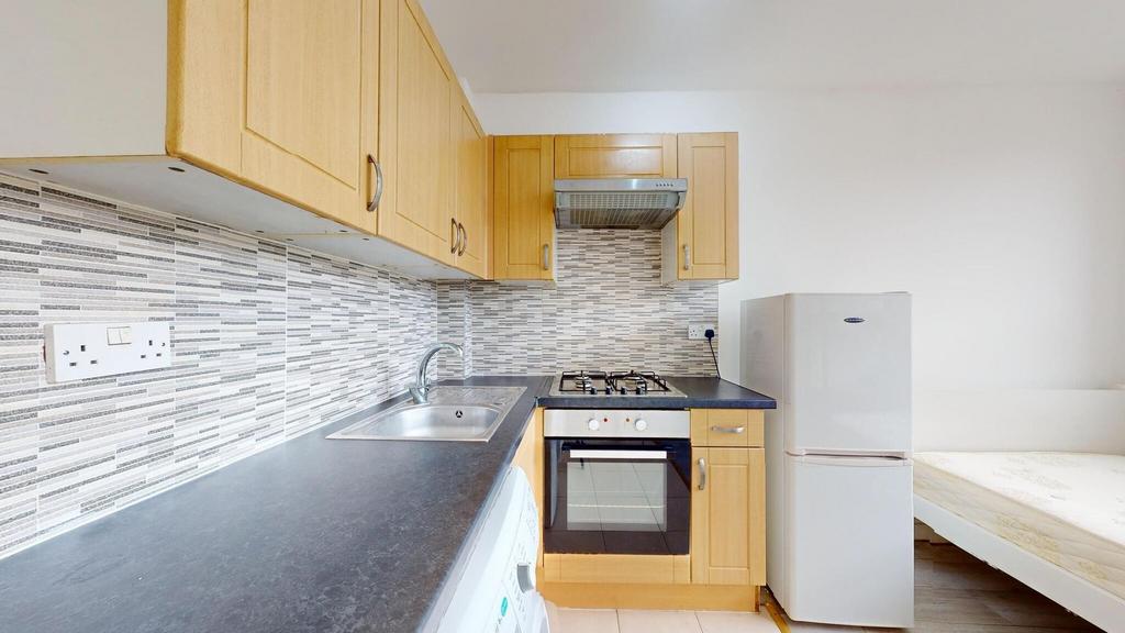 A well-organized kitchen featuring wooden cabin...