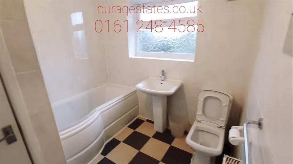 A bright, well-maintained bathroom featuring a ...