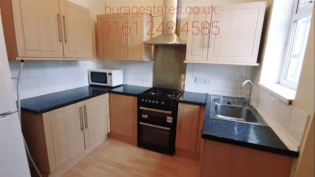 Bright and modern kitchen with ample natural li...