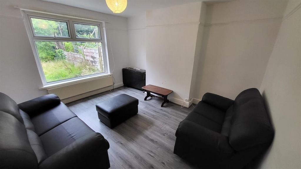 A bright and tidy living room featuring modern ...