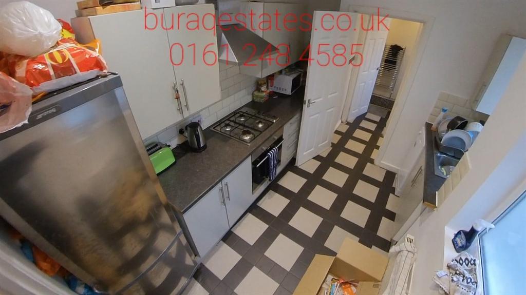 A well-maintained kitchen featuring modern appl...